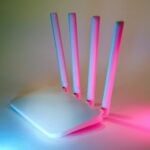 A white laptop computer sitting on top of a table