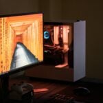 black flat screen computer monitor turned on near black computer keyboard