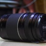 a close up of a camera lens on the ground