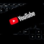 Youtube logo on a backlit keyboard.