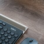 black Logitech keyboard beside mouse