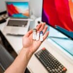 person holding silver and diamond ring