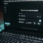 Laptop screen showing a search bar.