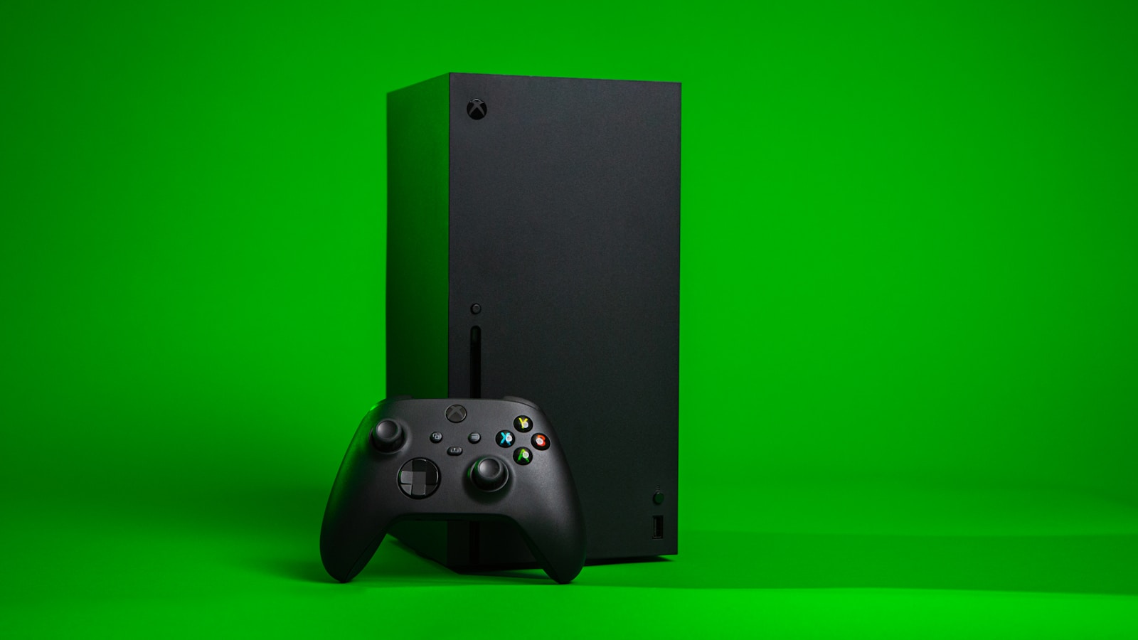 black xbox series x console with controller