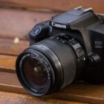 a camera sitting on top of a wooden bench