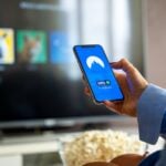 person holding blue iphone 5 c