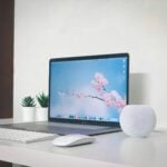silver imac on white table