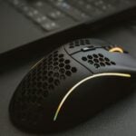black and yellow logitech computer mouse