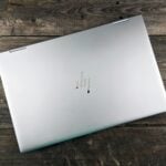 a white rectangular device on a wooden surface