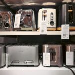 A bunch of toasters that are on a shelf