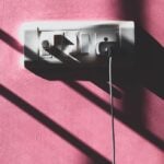 black usb cable plugged in white power outlet