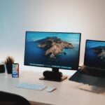 black flat screen computer monitor on white table