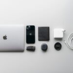 a white apple laptop sitting on top of a table