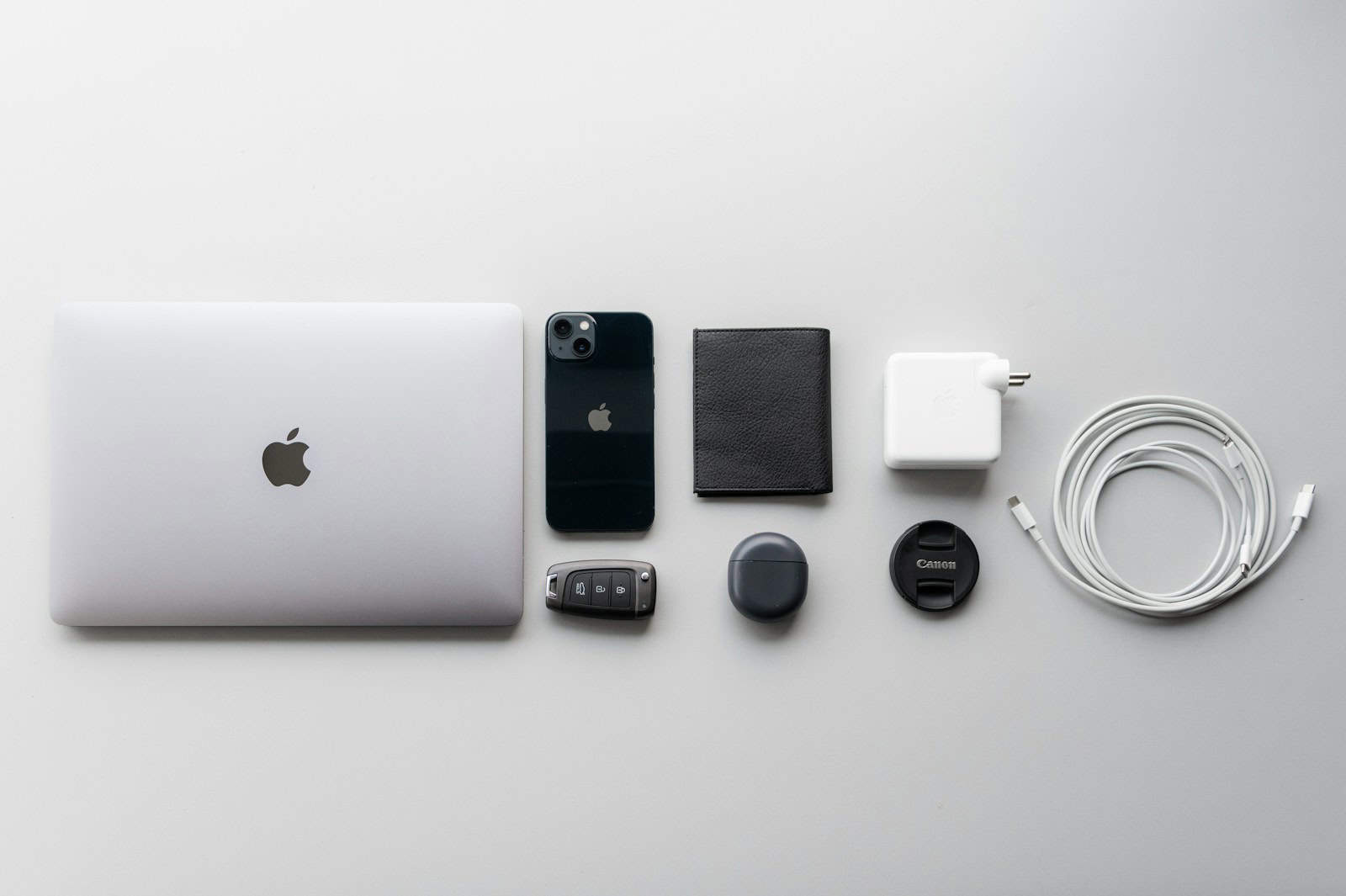 a white apple laptop sitting on top of a table