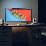 A computer monitor sitting on top of a desk