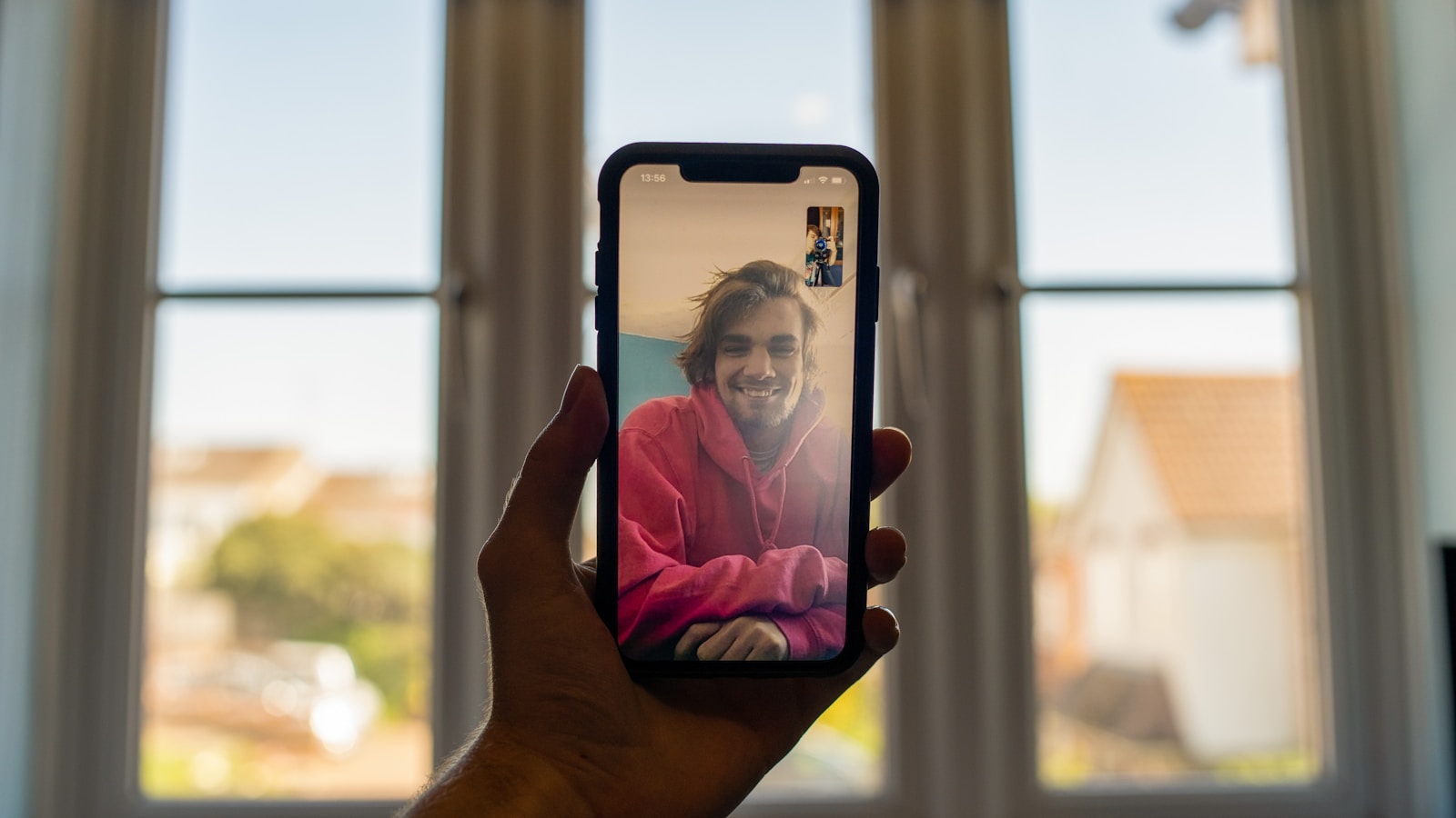 person holding black iphone