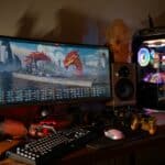 black flat screen computer monitor turned on beside black computer keyboard