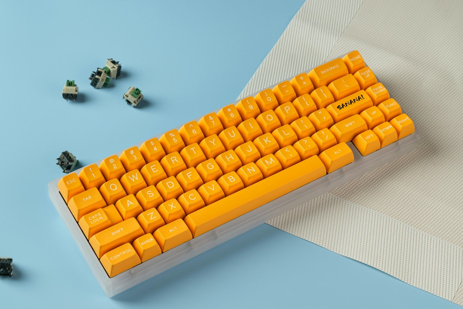 A yellow keyboard sitting on top of a piece of paper